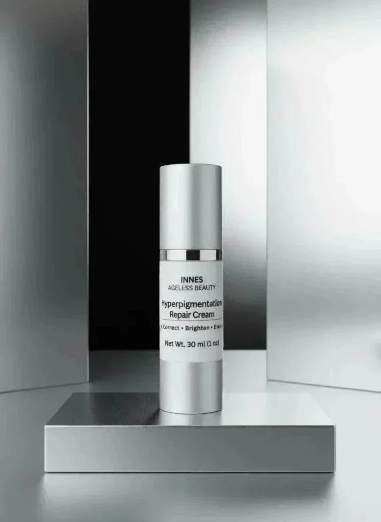 Hyperpigmentation Repair Cream in a sleek silver cylindrical bottle with a white label and pump cap