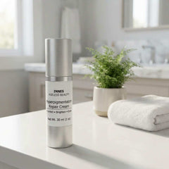 Hyperpigmentation Repair Cream in a silver cylindrical pump bottle with a white label and black text