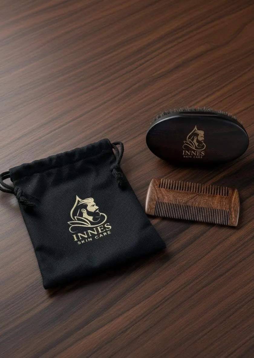 Innes Skin Care wooden beard brush, dual-sided beard comb and black drawstring storage bag displayed on a dark wood surface