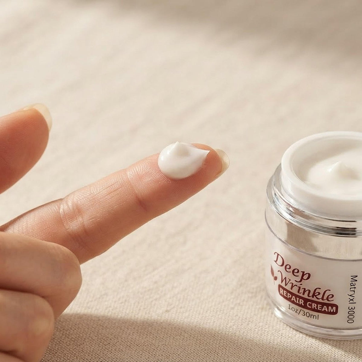 Close-up of the smooth white moisturizing cream texture on a fingertip.