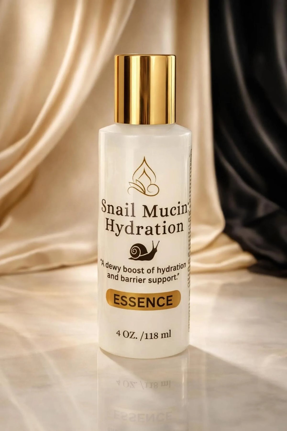 Snail Mucin Hydration Essence in white 4 oz bottle with gold cap, lightweight hydrating facial essence for mature and dry skin
