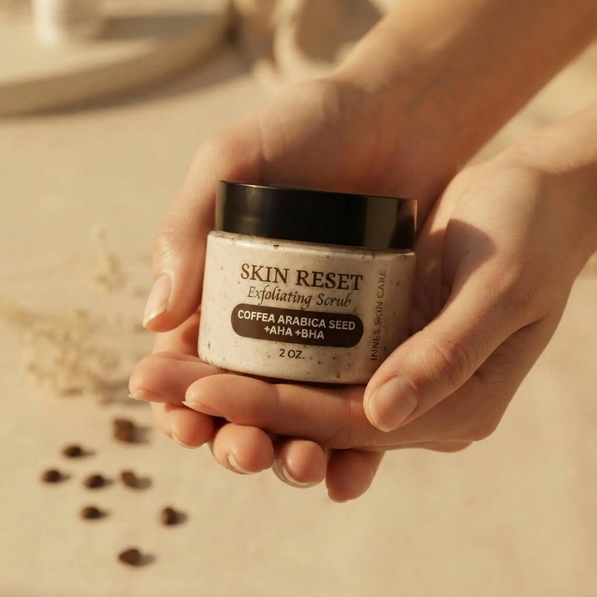 Hands holding the 2 oz skincare jar to show scale and container size