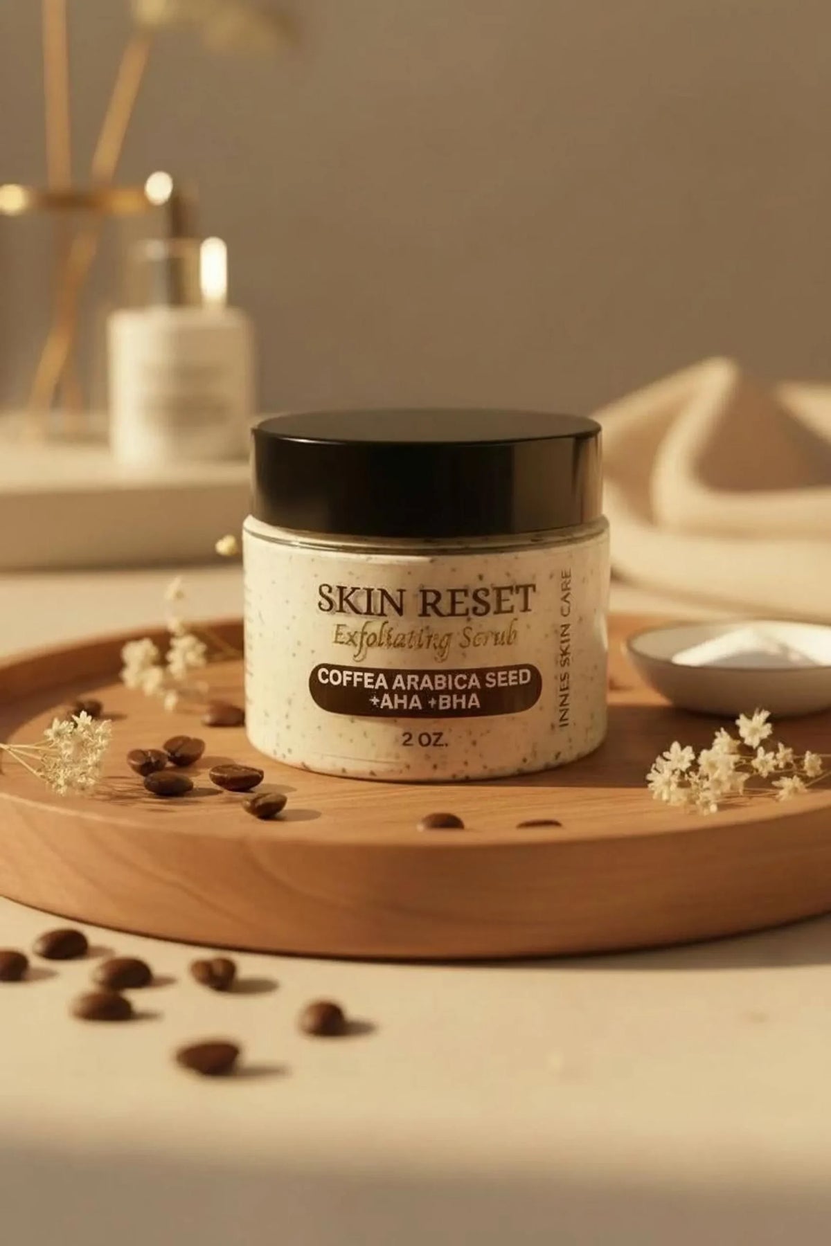 Skin Reset exfoliating face scrub with coffee seed, AHA and BHA in 2 oz jar with black lid and coffee beans