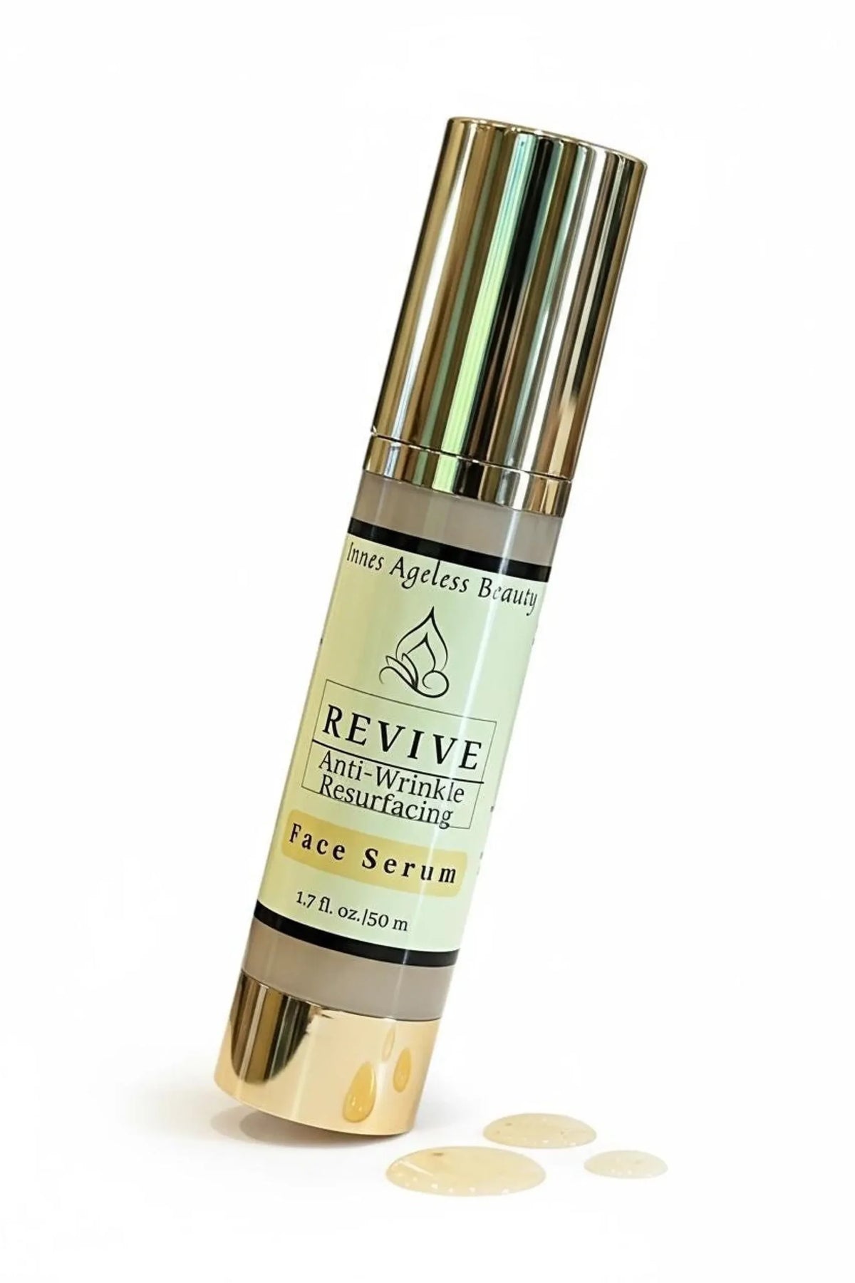 Revive anti wrinkle resurfacing face serum in gold airless pump bottle with lightweight serum texture for mature skin, glow support, and smoother looking complexion