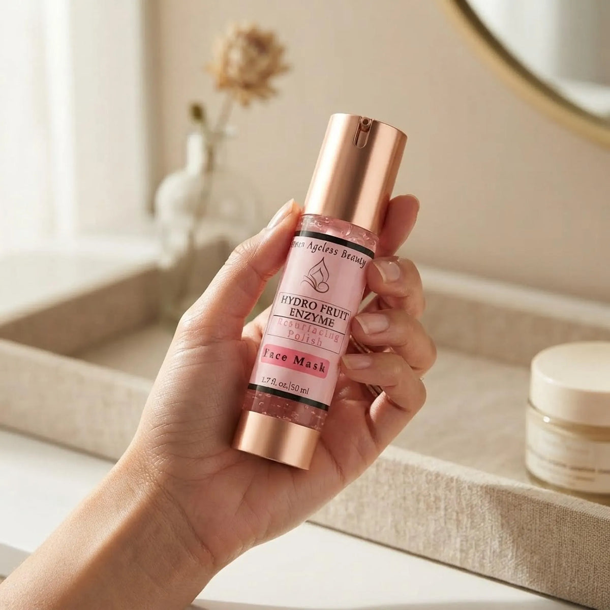 A hand holding the Innes Ageless Beauty Hydro Fruit Enzyme Resurfacing Polish bottle showing its size