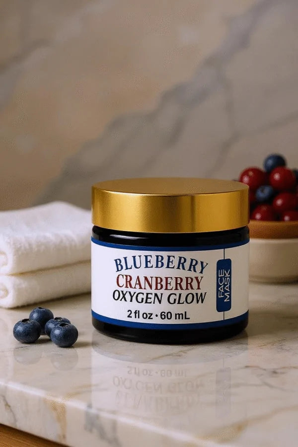 Innes Ageless Beauty Blueberry Cranberry Oxygen Glow Face Mask displayed on a marble surface with fresh blueberries, cranberries and folded white towels